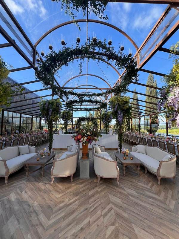 Lounge seating with floral arch