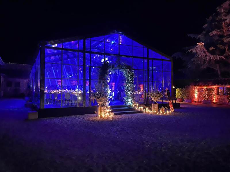 Blue lit glass structure at night